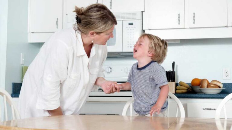 Parent calming toddler tantrum, understanding 2-year-olds have meltdowns