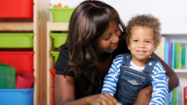 Mother hugging toddler, emotional connection and signs of autism at 18 months