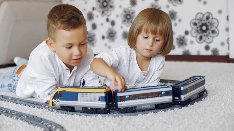 Children playing with toy trains as an example of special interests in autism