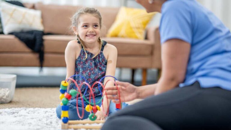 Sustaining progress in ABA therapy through ABA parent training with a child and therapist at home.