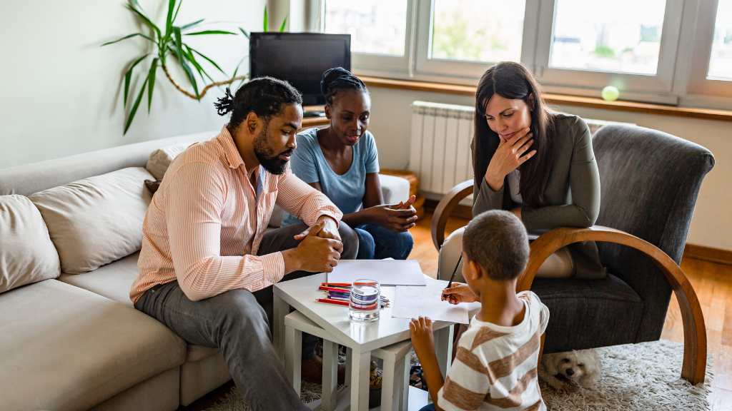 Family meeting with a therapist discussing trauma and mental health in autism.