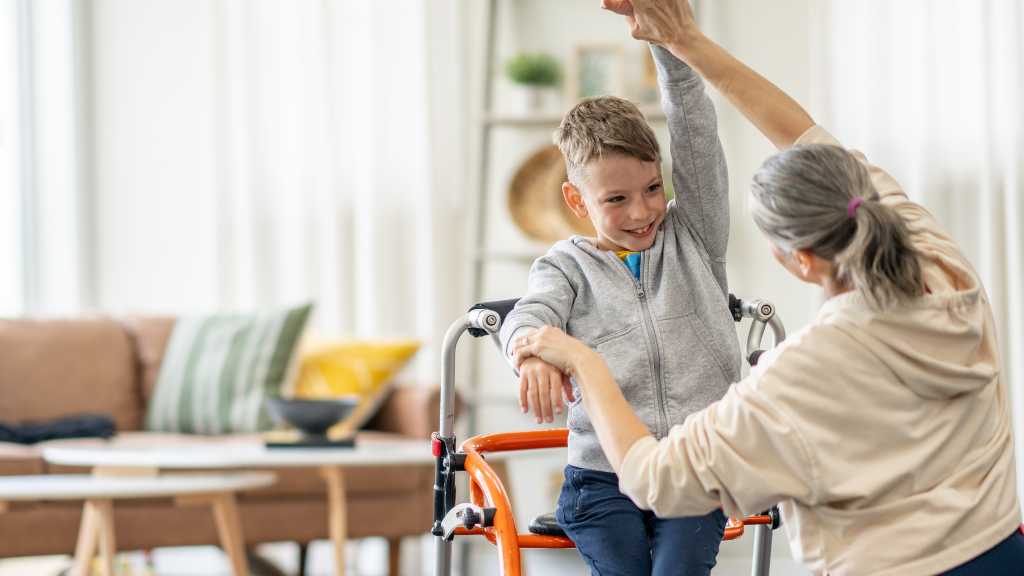 Sustaining progress in ABA therapy at home with therapist guiding child and reinforcing ABA parent training.