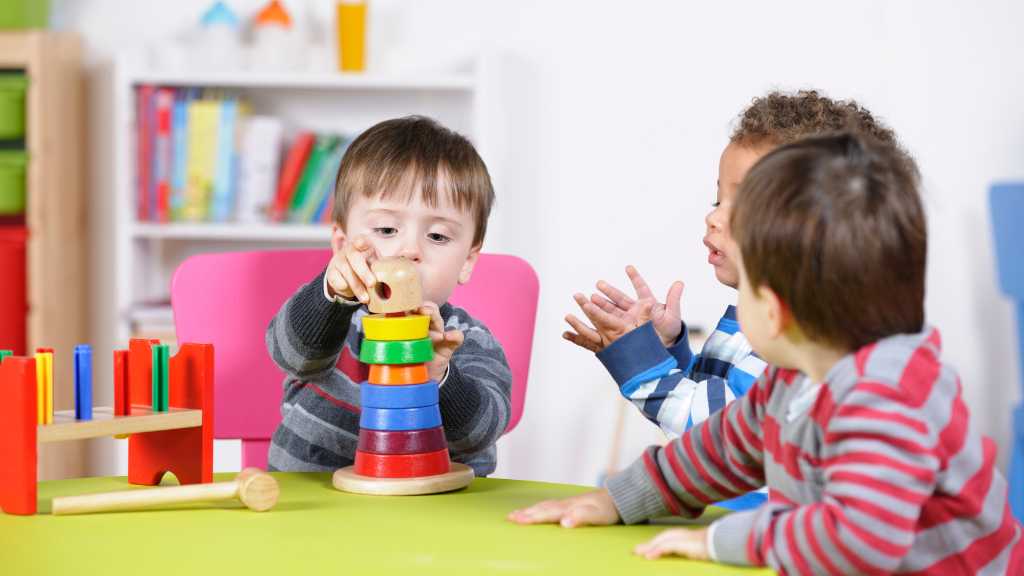 Toddlers practicing communication through group play in ABA for language development