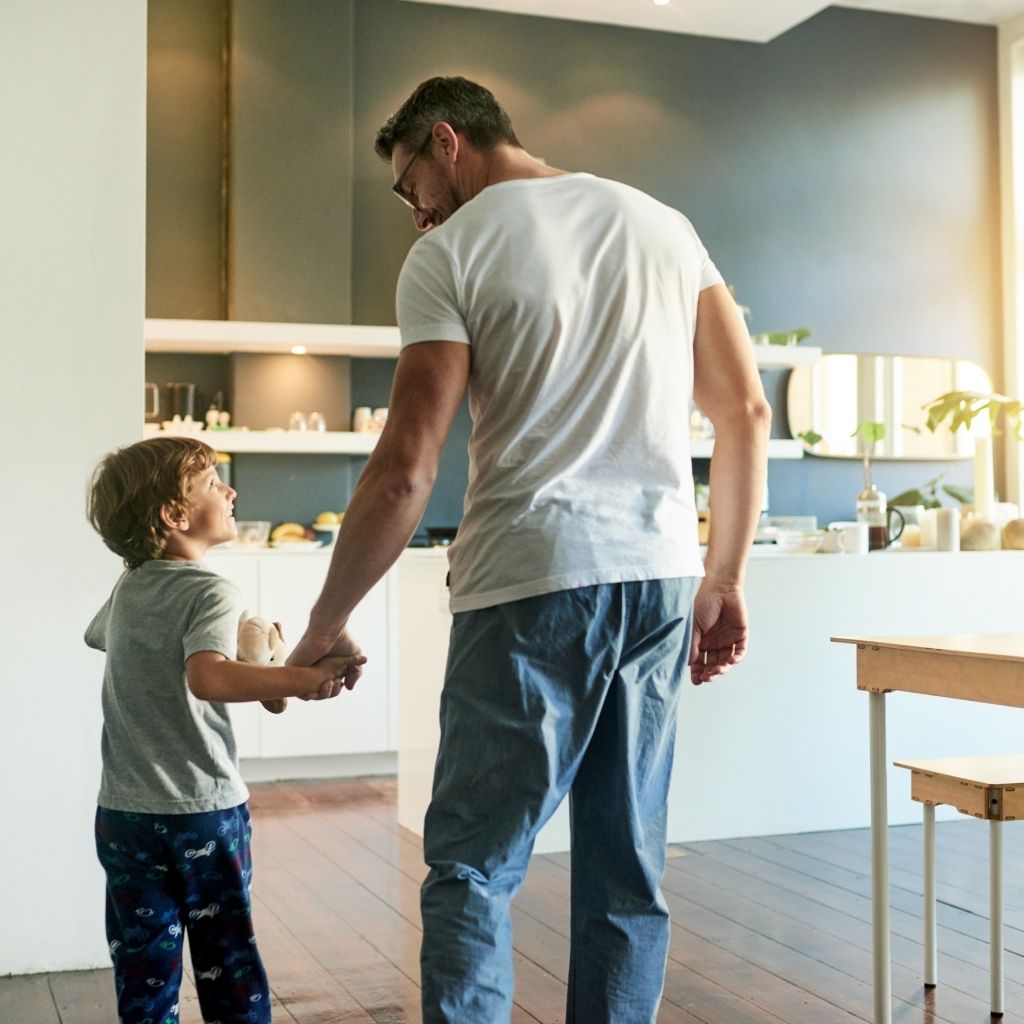 Parent supporting a young child during an everyday routine