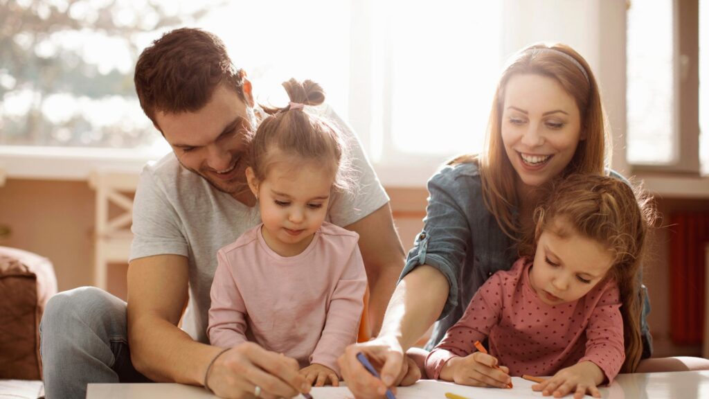 Parents and children enjoying a learning activity together at home