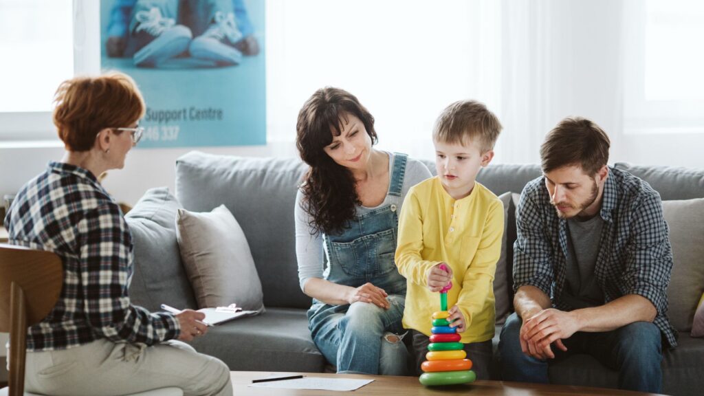 Parents and child meeting with a professional to discuss individualized support with aba strategies for parents at home