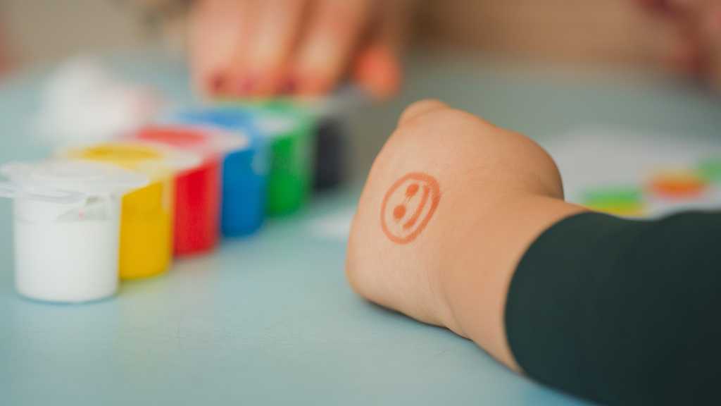 Smile stamp used as positive reinforcement in ABA therapy and play