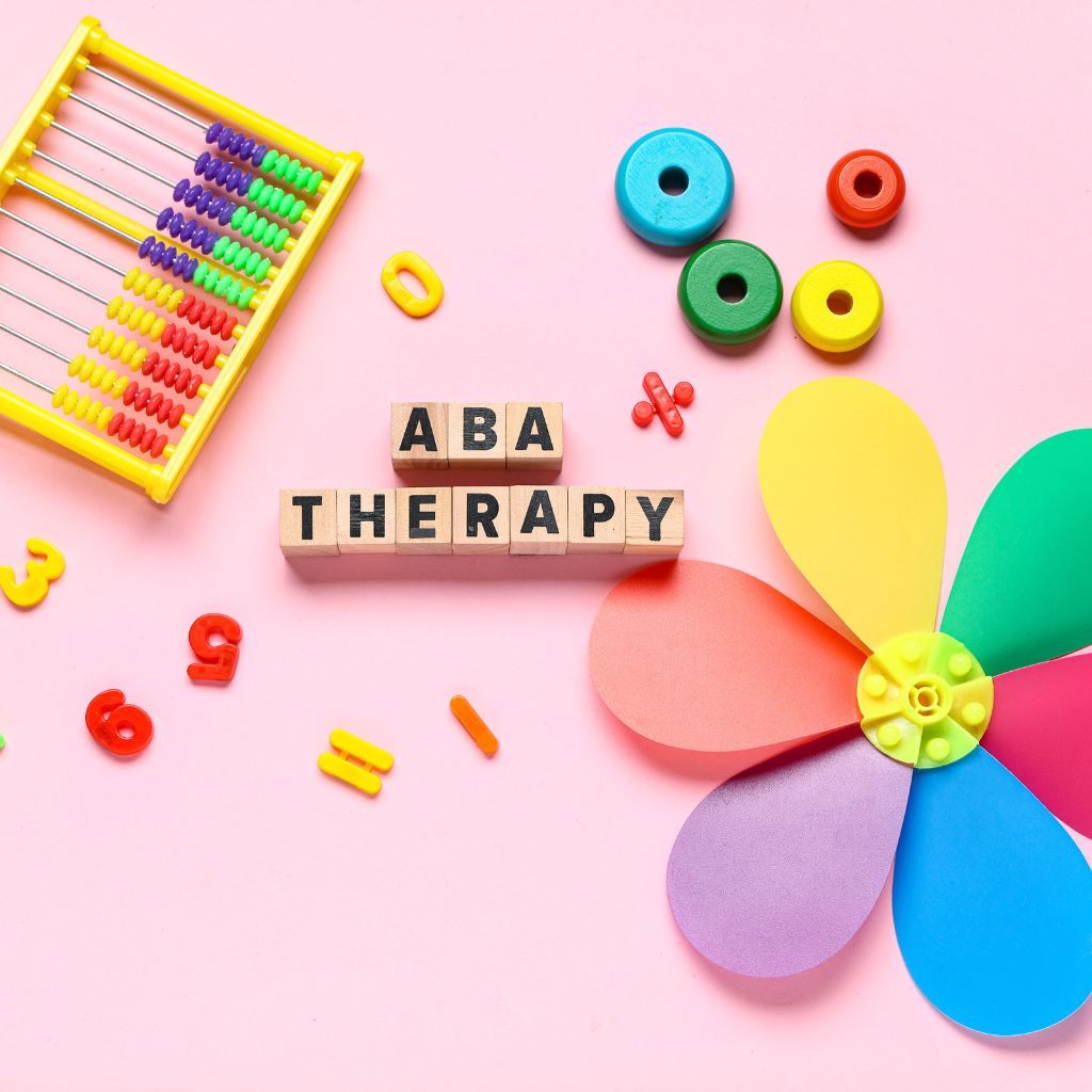 ABA therapy text surrounded by colorful learning materials