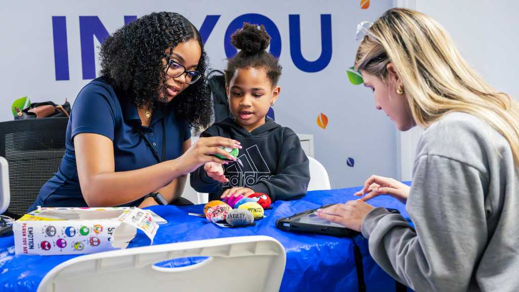 Child working on learning activity during ABA therapy progress