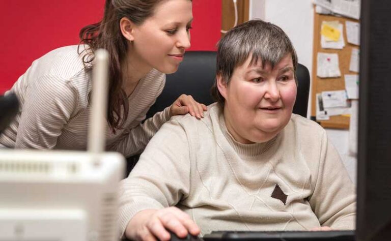 Autistic Adult Being Helped for a Therapist