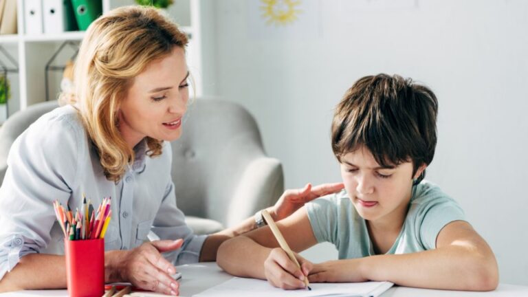 An adult supporting a child with autism and anxiety