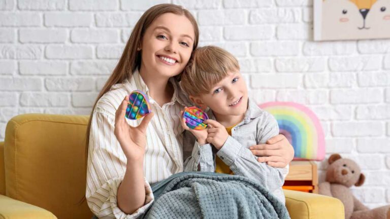 Parent and child with sensory toys, autism in young children and early support