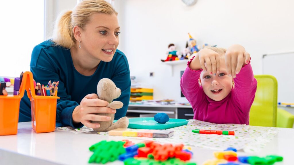 Child participating in an individualized therapy activity with a professional
