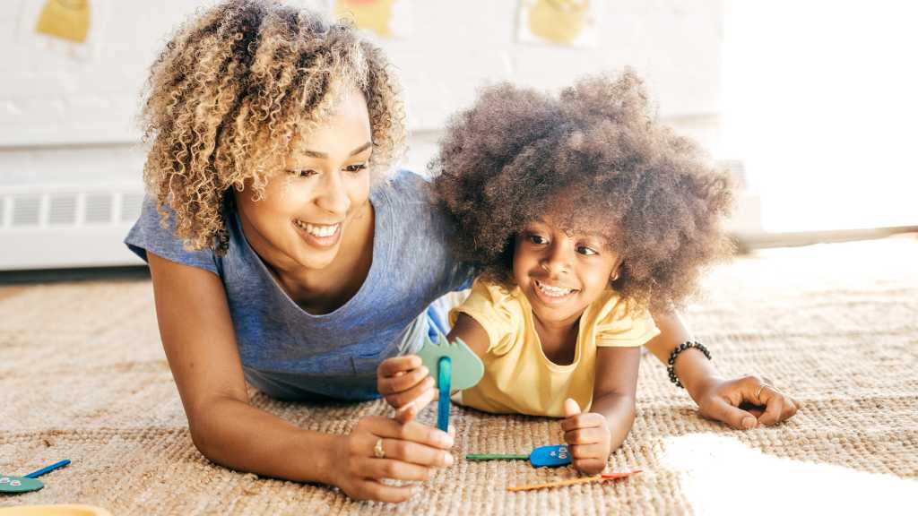 Parent playing with toddler, developmental milestones at 24 months and social bonding