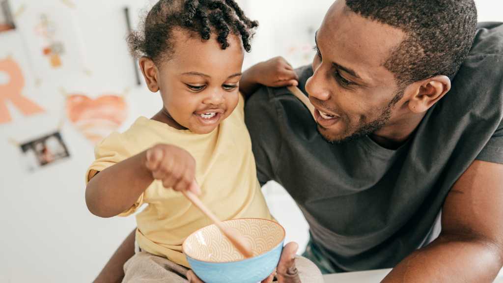 Father interacting with toddler, autism and eye contact during daily communication