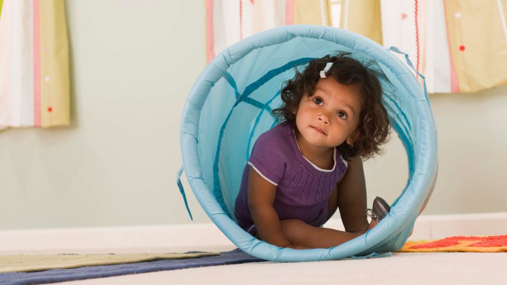 Young child participating in a movement-based play activity as a part of ABA therapy for preschoolers
