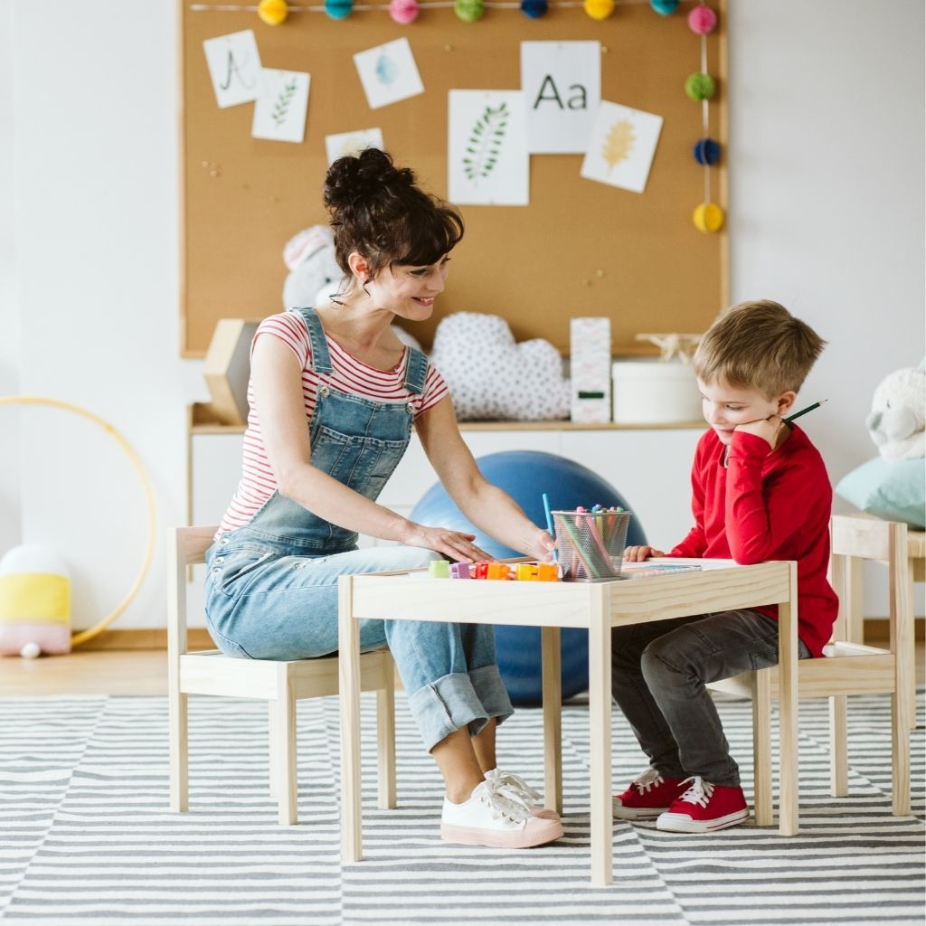 Child participating in an individualized therapy activity with a professional