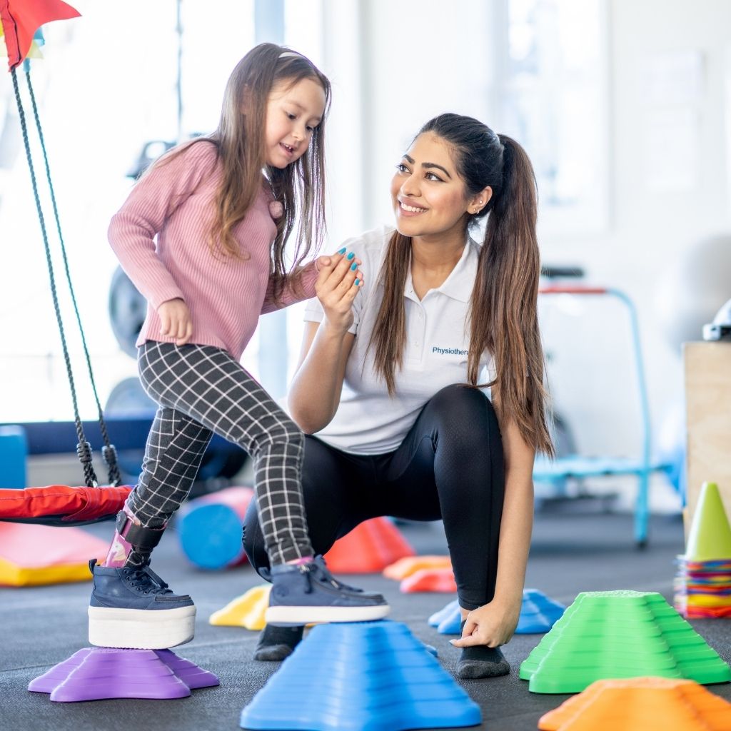 Child practicing motor skills with an occupational therapy professional