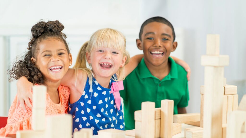 Preschool children smiling together during a group activity