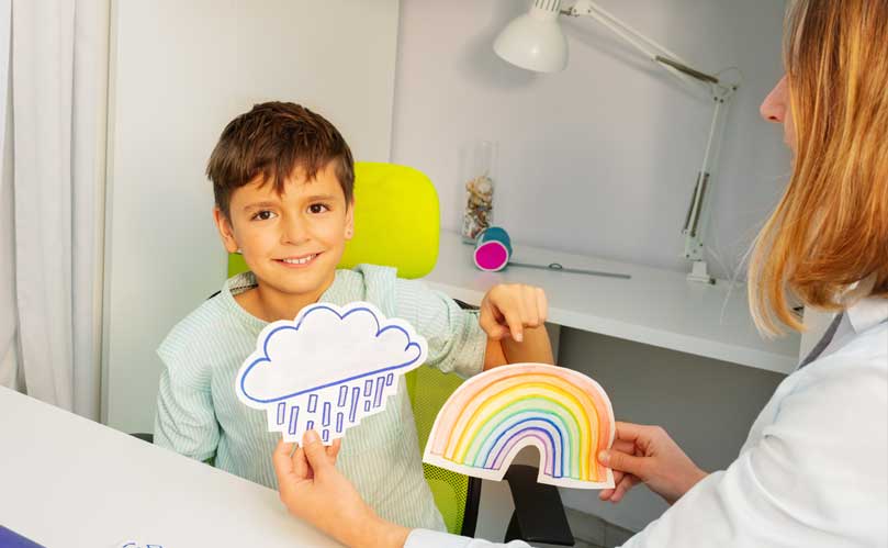 A autism boy choosing a rainbow