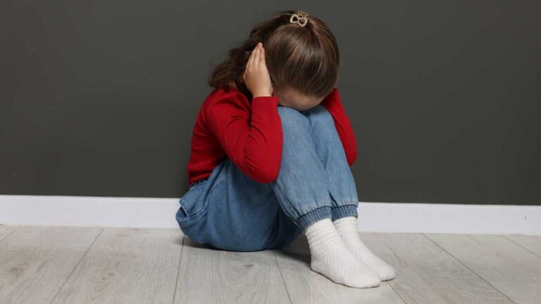 Toddler covering ears, sensory overload in a toddler and sensory issues in kids