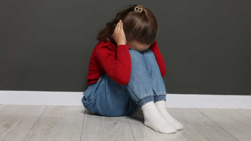 Toddler covering ears, sensory overload in a toddler and sensory issues in kids