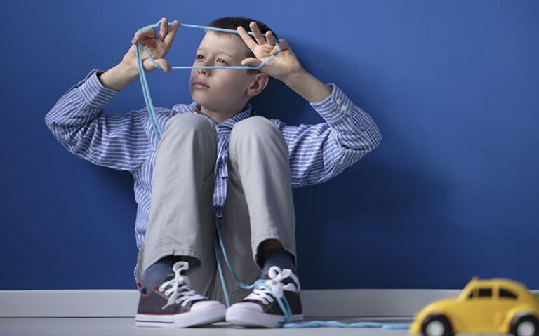 Boy sitted waiting for ABA Therapy