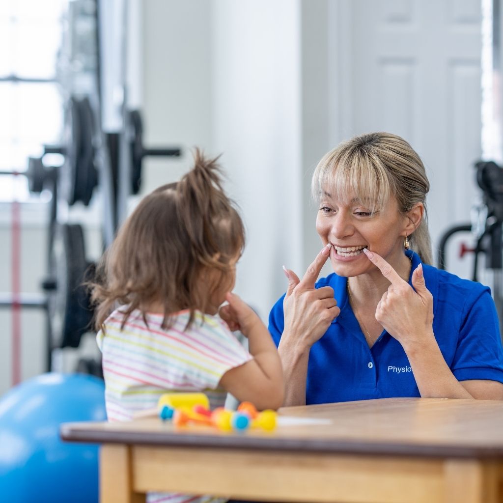 Professional practicing communication skills with a young child