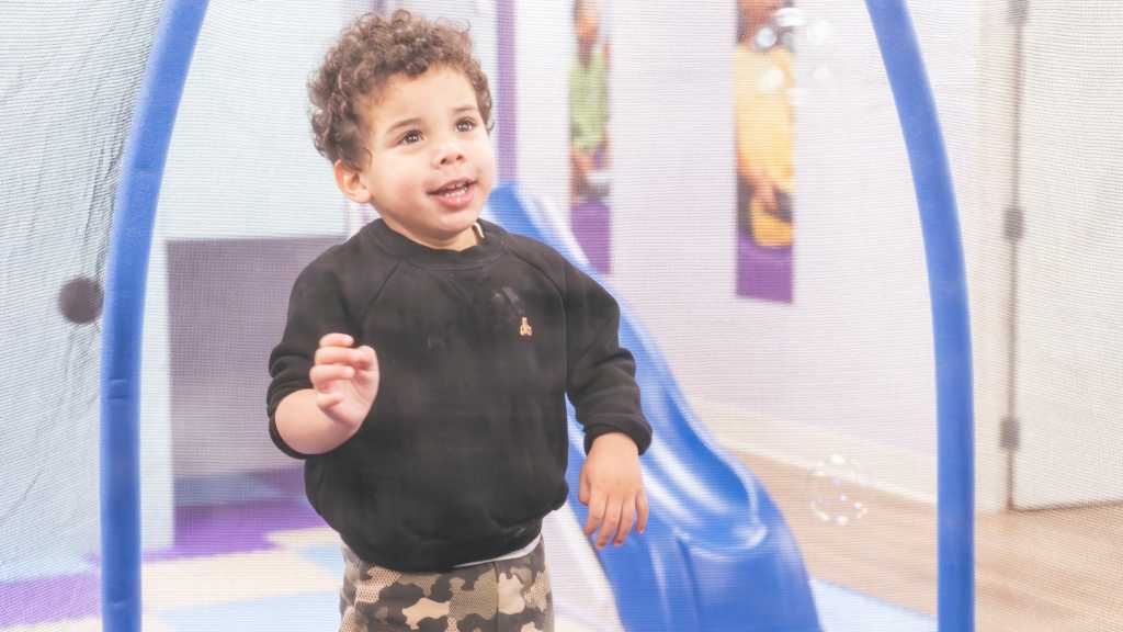 Toddler in an ABA therapy playroom during early intervention therapy