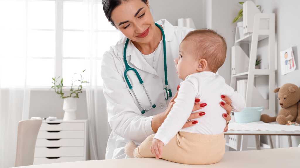 Developmental pediatrician interacting with infant during developmental assessment